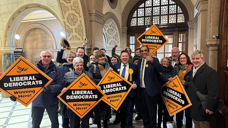 A group of Ssheffield Liberal Democrats celebrating in the town hall lobby