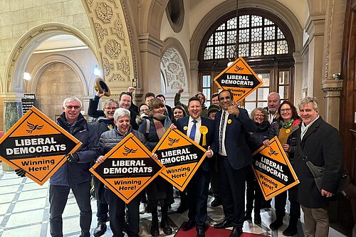 A group of Ssheffield Liberal Democrats celebrating in the town hall lobby