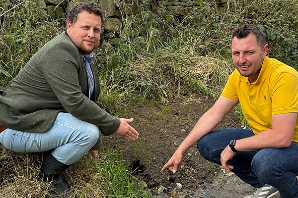 Will Sapwell (left) at a leak