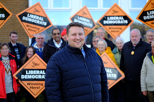 Dr Will Sapwell in front of a group of Lib Dem campaigners in Stannington