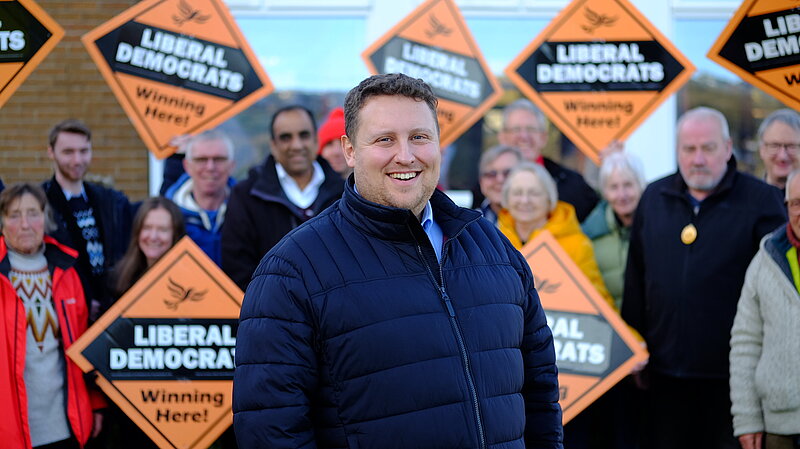 Dr Will Sapwell in front of a group of Lib Dem campaigners in Stannington